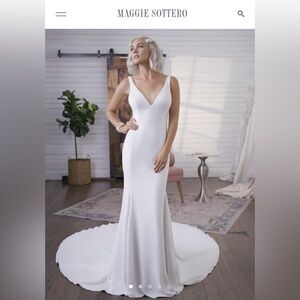 Lightly worn classic white fitted wedding gown with train